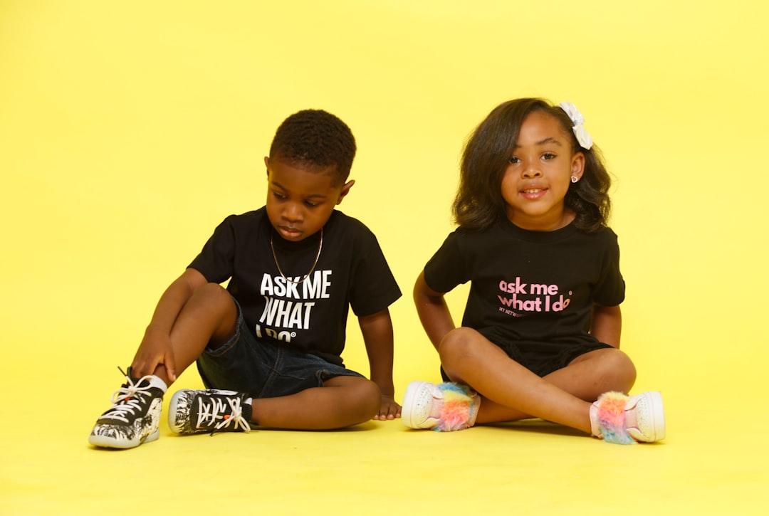 man-in-black-crew-neck-t-shirt-sitting-beside-girl-in-white-t-shirt-54ve0-oytqo